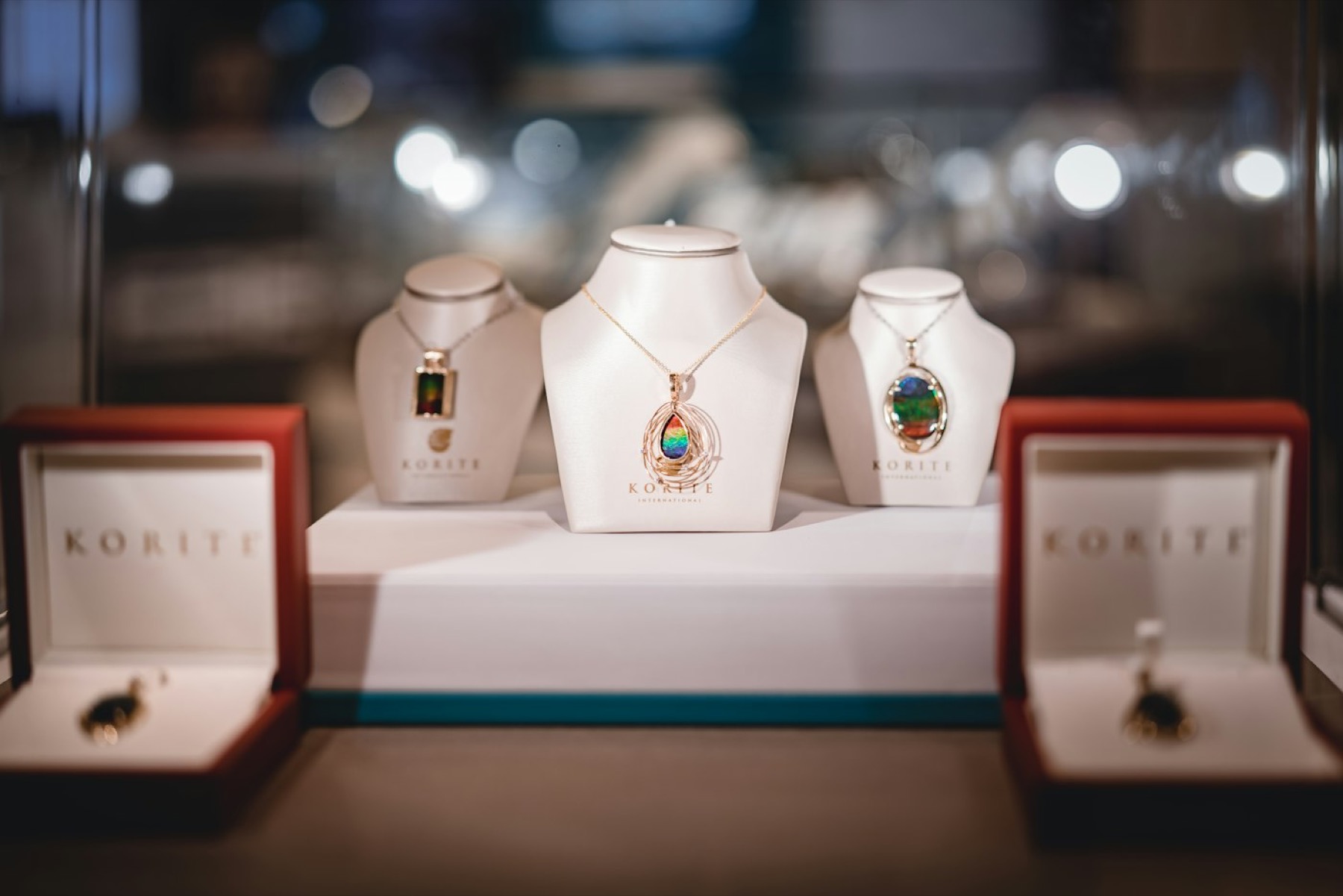 Necklaces displayed on busts in a jewellery showroom